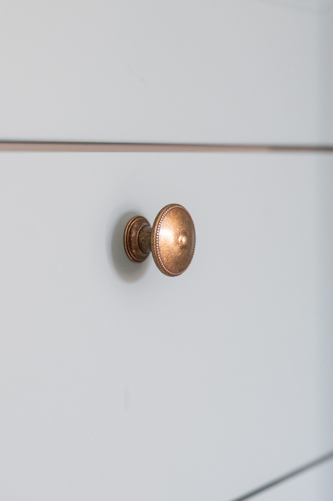 Détail – bouton en laiton Détail – bouton en laiton